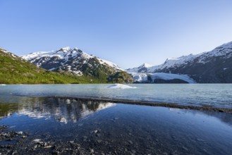 Snowy mountains and glaciers Portage Glacier on Portage Lake glacial lake, Chugach National Forest,