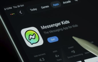 Dhaka, Bangladesh- 30 Oct 2025: Messenger Kids app displayed on a iPad screen in dark mode with a