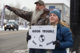 Saline, Michigan USA - 1 December 2025 - Rural Michigan residents rally against the $7 billion