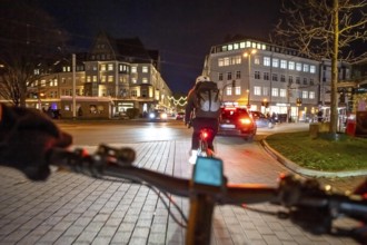 Cycling in the city, in the dark, in the evening, inner-city road, bicycle road, two-wheeler