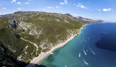 Picturesque rocky coast, cliffs and Cala Luna beach, aerial view, Golfo di Orosei, Baunei,