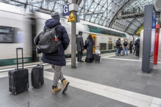 Central Station in Berlin, passengers on the platform, train arrives, Germany