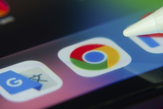 16 Nov 2025- Dhaka, Bangladesh: Stylus touching the Google Chrome app icon on a smartphone screen