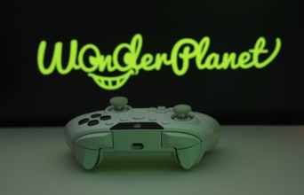 Dhaka, Bangladesh- 14 Nov 2025: A close-up of a white gamepad with the WonderPlanet Inc seen on