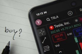 Dhaka, Bangladesh- 20 June 2025: Tesla Inc stock trading details displayed on smartphone with