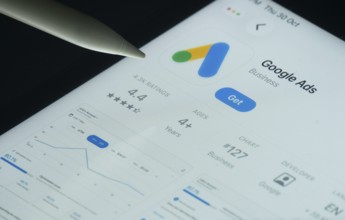 Dhaka, Bangladesh- 30 Oct 2025: Google Ads app on a iPad screen with a pen pointing at the install