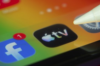 16 Nov 2025- Dhaka, Bangladesh: Stylus touching the Apple TV app icon on a smartphone screen