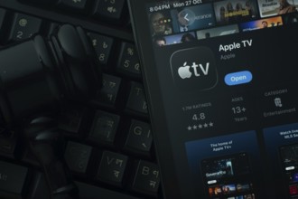 Dhaka, Bangladesh- 28 Oct 2025: An iPad displaying the Apple TV app against a judge's gavel and