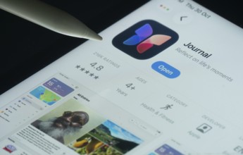 Dhaka, Bangladesh- 30 Oct 2025: Apple Journal app on a iPad screen with a pen pointing at the