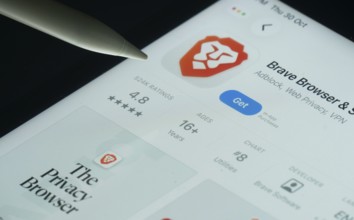 Dhaka, Bangladesh- 30 Oct 2025: Brave browser app on a iPad screen with a pen pointing at the