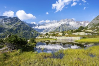 Picturesque mountain landscape, dammastock and damma glaciers reflected in Moorsee, Göscheneralp,