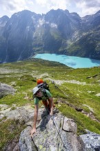 Mountaineer climbs on the secured Schijen-Zwärg via ferrata, climb to Bergseehütte, Göscheneralp in