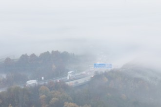 Aichelberg Alb climb of the A8 in thick fog on an autumn morning. Lkr. Göppingen,