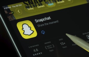 Dhaka, Bangladesh- 30 Oct 2025: Snapchat app displayed on a iPad screen in dark mode with a digital