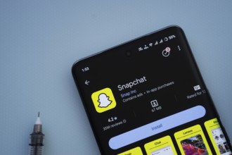 Dhaka, Bangladesh- 29 May 2025: On a blue surface, a smartphone displays the Snapchat app within