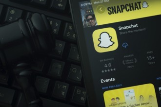 Dhaka, Bangladesh- 28 Oct 2025: An iPad displaying the Snapchat app against a judge's gavel and