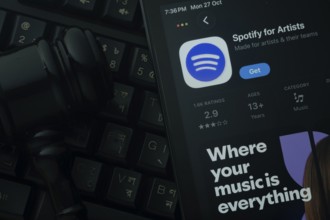 Dhaka, Bangladesh- 28 Oct 2025: An iPad displaying the Spotify for Artist app against a judge's