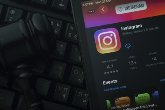 Dhaka, Bangladesh- 28 Oct 2025: An iPad displaying the Instagram app against a judge's gavel and