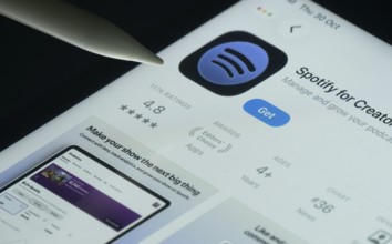 Dhaka, Bangladesh- 30 Oct 2025: Spotify for Creators app on a iPad screen with a pen pointing at