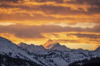 Grossglockner peaks at sunset in winter, spectacular cloudy skies, Hochbrixen, Brixen im Thale,