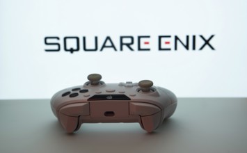 Dhaka, Bangladesh- 14 Nov 2025: A close-up of a white gamepad with the Square Enix seen on screen