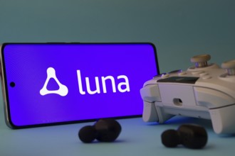 Dhaka, Bangladesh- 23 Mar 2025: A smartphone with a Amazon Luna icon next to a controller and