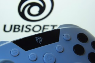 Dhaka, Bangladesh- 14 Nov 2025: A close-up of a gamepad with the Ubisoft seen on screen in the