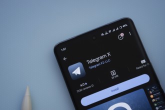 Dhaka, Bangladesh- 29 May 2025: On a blue surface, a smartphone displays the Telegram X app within