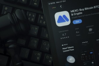 Dhaka, Bangladesh- 28 Oct 2025: An iPad displaying the MEXC app against a judge's gavel and dark