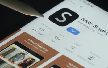 Dhaka, Bangladesh- 30 Oct 2025: SHEIN app on a iPad screen with a pen pointing at the install