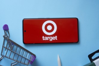 Dhaka, Bangladesh- 03 July 2025: Smartphone displaying Target logo with shopping cart on a blue