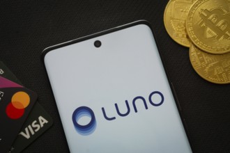 Dhaka, Bangladesh- 06 Sep 2025: Smartphone displaying Luno logo surrounded by Bitcoin coins and