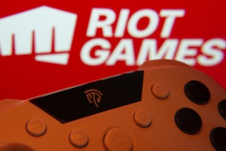 Dhaka, Bangladesh- 14 Nov 2025: A close-up of a gamepad with the Riot Games seen on screen in the