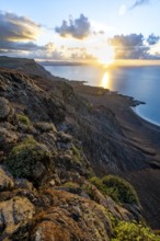 View of steep cliffs on sea and coast, Mirador del Porrito viewpoint at sunset, Lanzarote, Canary