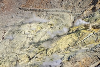 Steaming fumaroles in the Owakudani geothermal area at Komagatake volcano, Hakone, Japan