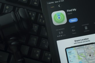 Dhaka, Bangladesh- 28 Oct 2025: An iPad displaying the Apple Find My app against a judge's gavel