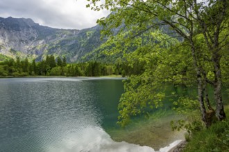 Landscape of Lake Offensee after rain when the sun comes through the clouds in spring,
