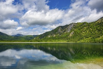 Landscape of Lake Offensee after rain when the sun comes through the clouds in spring,