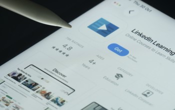 Dhaka, Bangladesh- 30 Oct 2025: Linkedin Learning app on a iPad screen with a pen pointing at the