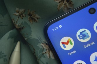 Dhaka, Bangladesh- 07 May 2025: Gmail and Outlook app icon is seen on smartphone