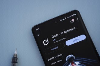 Dhaka, Bangladesh- 29 May 2025: On a blue surface, a smartphone displays the Grok Ai app within the