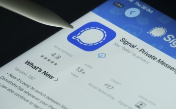 Dhaka, Bangladesh- 30 Oct 2025: Signal app on a iPad screen with a pen pointing at the install