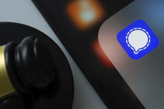 Dhaka, Bangladesh- 01 Nov 2025: A close up of an iPad screen displaying the Signal app alongside a