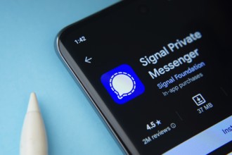 Dhaka, Bangladesh- 29 May 2025: On a blue surface, a smartphone displays the Signal app within the