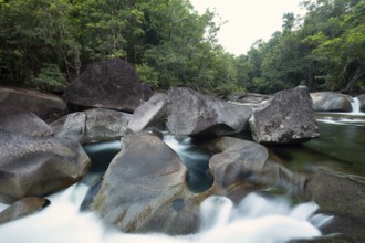 Turquoise blue water between rocks in the tropical rainforest of Babinda Boulders Queensland