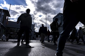 Passers-by in downtown Essen at the main train station, North Rhine-Westphalia, Germany