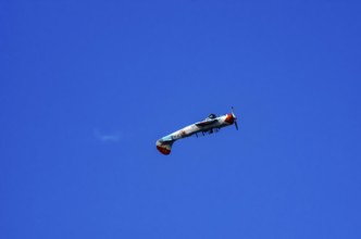A Jakovlev Jak-52 with registration LY-HLZ during a flight demonstration as part of an air show on