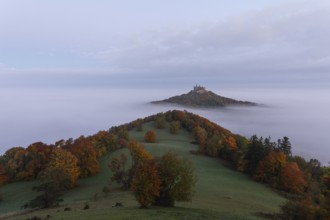 Hohenzollern Castle in a sea of fog at sunrise, autumn in the Swabian Jura