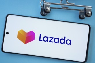 Dhaka, Bangladesh- 03 July 2025: Smartphone screen showing the Lazada logo with shopping cart
