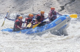 A group of people white water rafting, Costa Rica, Central America